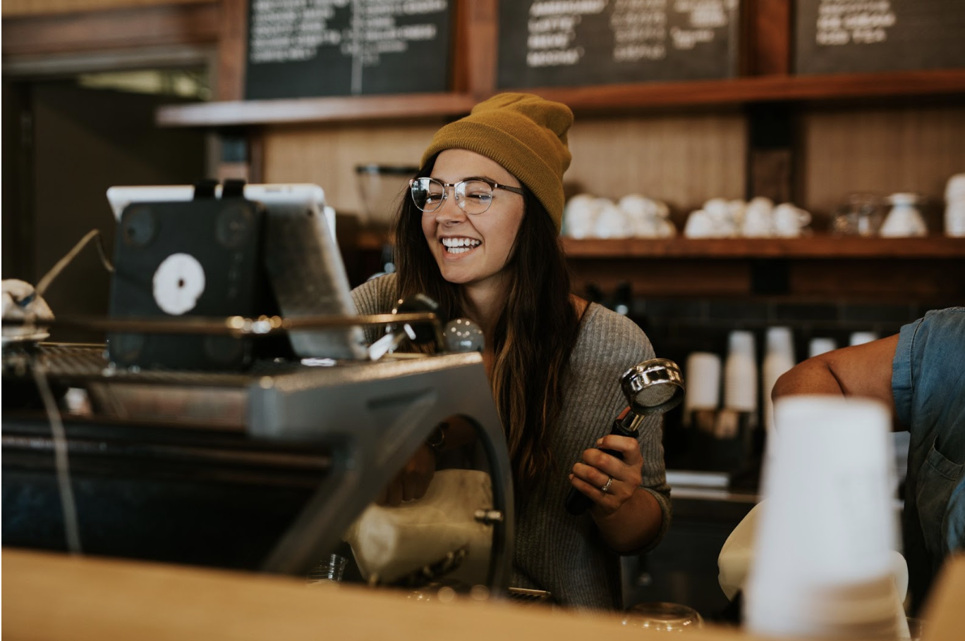 Female barista making coffee