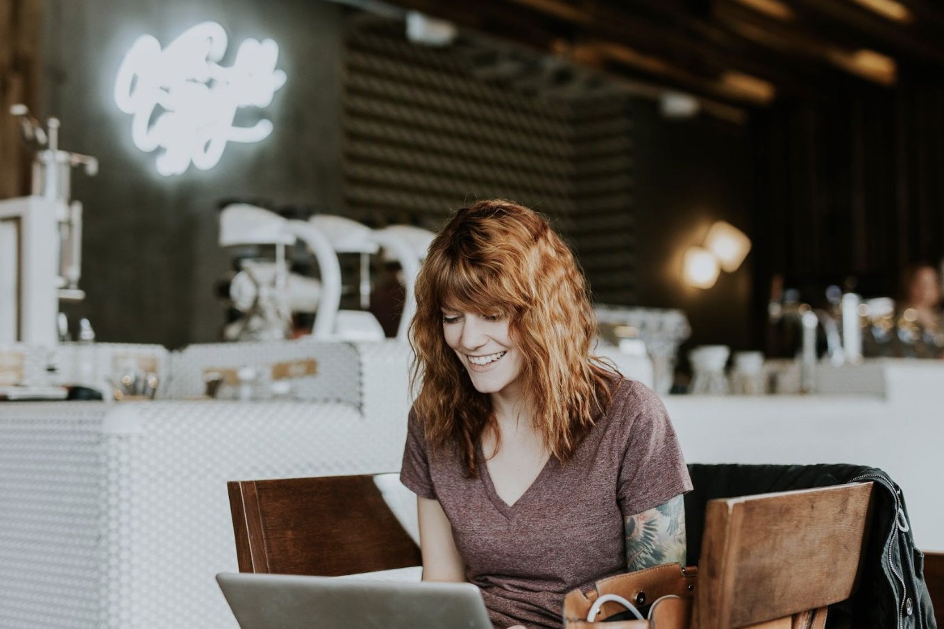 Woman managing her short-term rental business from laptop