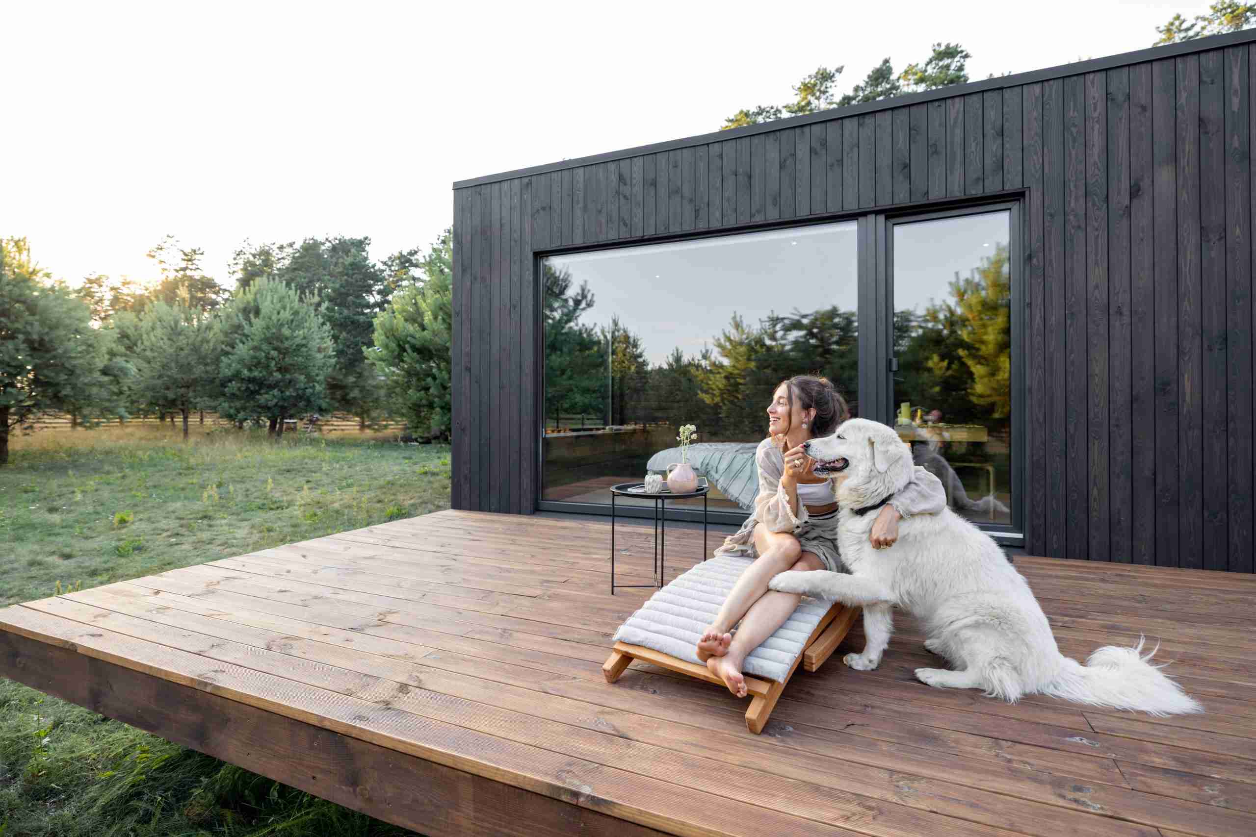 Woman enjoying a tiny house Airbnb