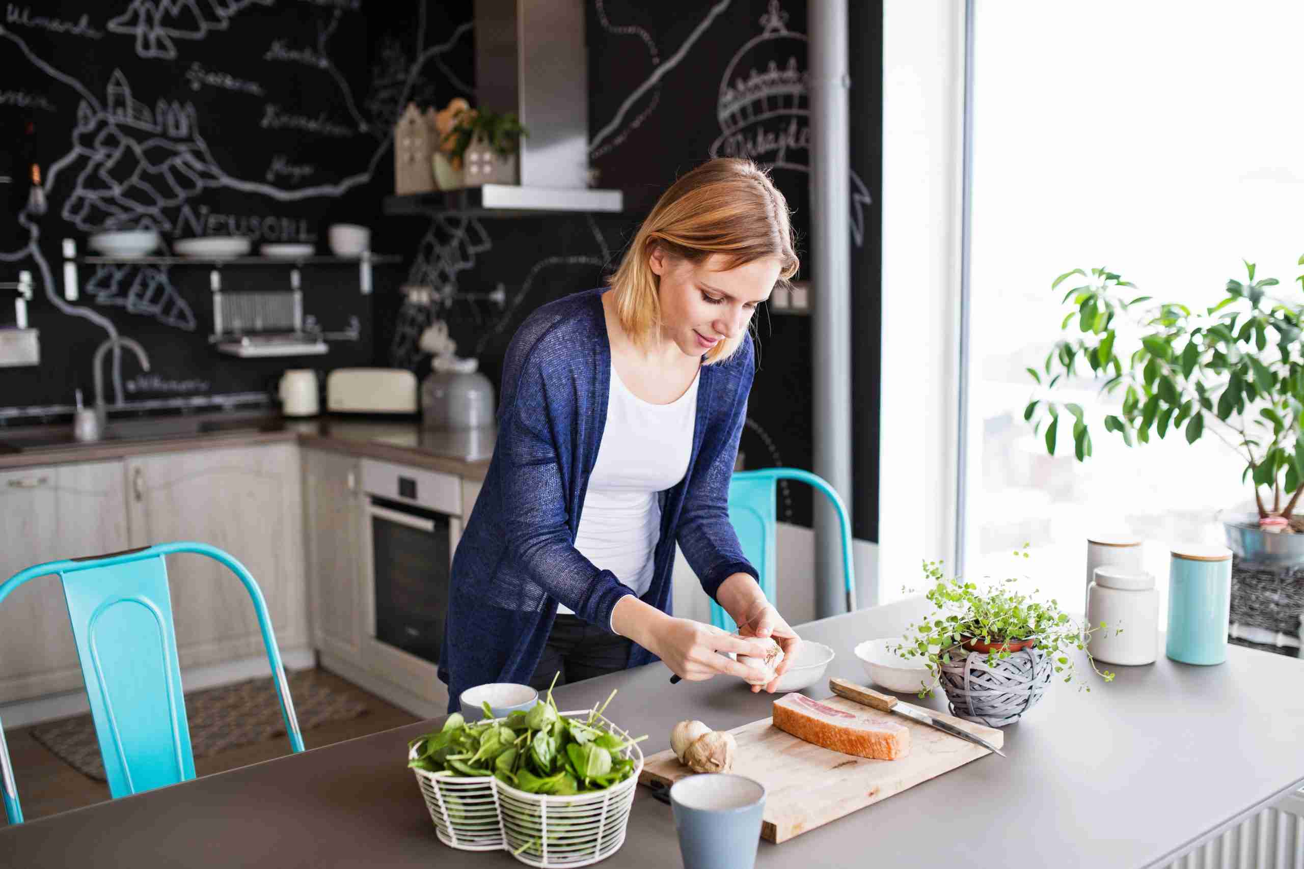 Young woman cooking at home.